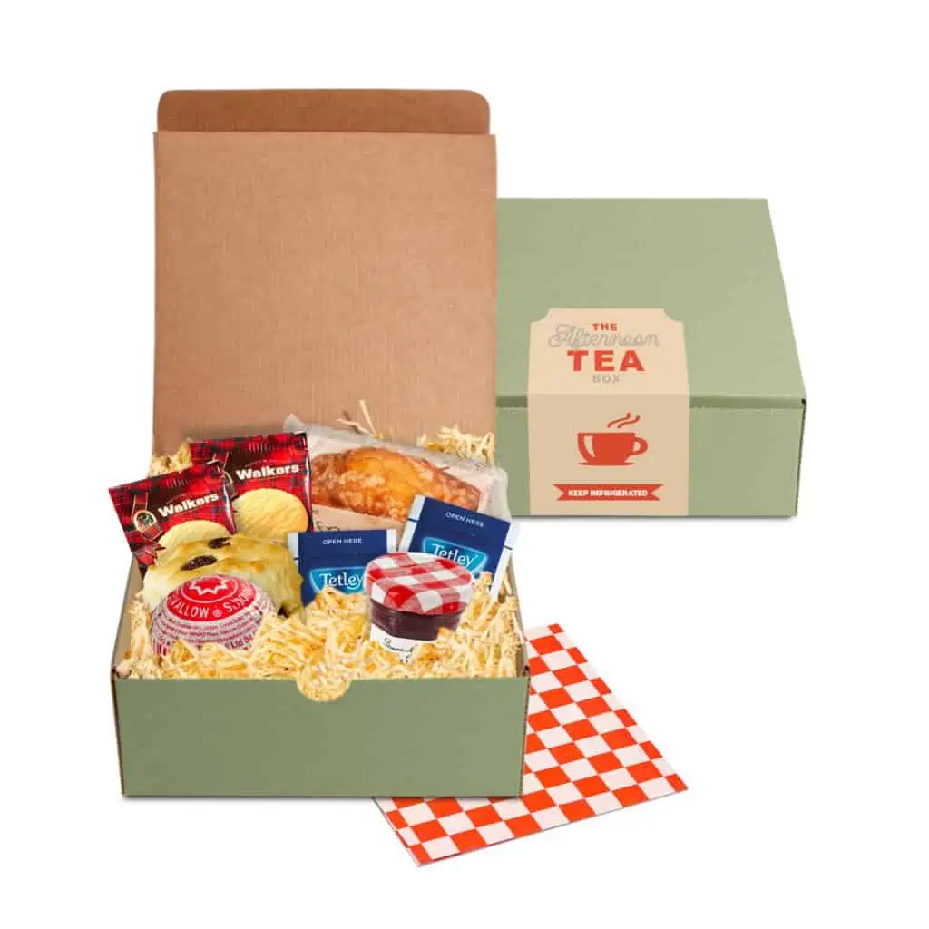 Afternoon Tea Box. Includes: cherry & sultana scone, fruit cake, milk chocolate tea cake, mini jam jar, mini shortbread and tea.