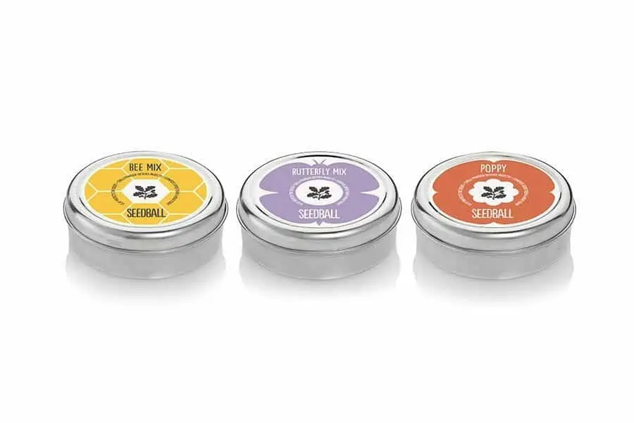 3 small seedball tins in yellow, purple and orange